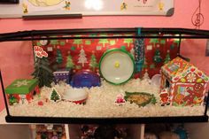 a display case filled with lots of christmas decorations and gifts in it's corner