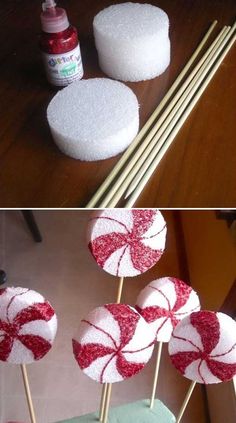 some candy lollipops are sitting on sticks