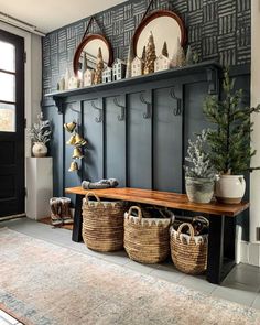 a room with some baskets and mirrors on the wall