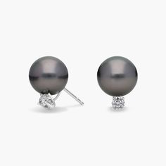 Each Tahitian cultured pearl is enhanced with a round diamond these earrings are set with 18k white gold post push backs for pierced ears. Tahitian Pearl Earrings In White Gold For Formal Occasions, Formal Tahitian Pearl Earrings In White Gold, Classic Tahitian Pearl Earrings For Formal Occasions, Tahitian Pearl Earrings In White Gold For Anniversary, Luxury Tahitian Pearl Earrings In White Gold, Anniversary White Gold Tahitian Pearl Earrings, Classic Tahitian Pearl Earrings For Anniversary, Classic Tahitian Pearl Earrings, White Gold Tahitian Pearl Round Earrings