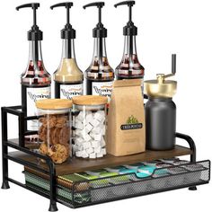 an assortment of condiments and snacks on a metal tray with black handles for storage