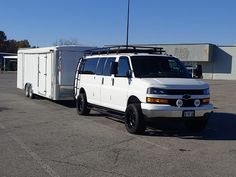 a white utility vehicle parked in a parking lot