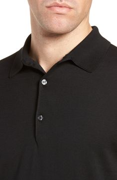 This unbelievably soft polo is spun from breathable sea island cotton and crafted with an eye for timeless British style. 27" length (size Medium) Three-button placket Spread collar Short sleeves Ribbed cuffs and hem 100% cotton Machine wash, line dry Made in the UK Men's Designer Semi-formal Polo Collar Top With Button Closure, Classic Polo Shirt With Buttons For Work, Formal Fitted Polo Shirt With Button Closure, Classic Polo Shirt With Button Closure And Spread Collar, Elegant Business Casual Polo Shirt With Button Closure, Casual Black Polo Sweater With Button Closure, Classic Polo Shirt With Buttons, Classic Polo Shirt With Buttons And Collared Neckline, Classic Polo Shirt For Business