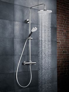 an open shower head with rain coming from it