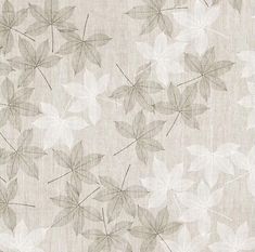 a beige and white wallpaper with leaf designs on it's back drop down