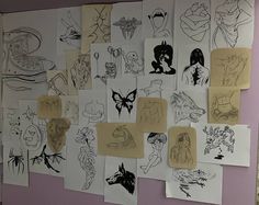 a wall covered in lots of cartoon drawings