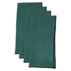 four dark green napkins on a white background