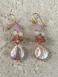 Pearl Earrings featuring a 14MM iridescent pink pearls accented with Swarovski 6MM crystals, dainty pink opal clusters and a pear shape faceted pink chalcedony bezel.  Gold filled lever back ear wires.  Earrings measure 2 3/4 inches. Handmade GIFT BOXED Elegant Rose Gold Earrings With Dangling Beads, Elegant Pink Beaded Earrings For Party, Elegant Rose Gold Beaded Earrings, Pink Round Pearl Earrings For Formal Occasions, Pink Round Pearl Earrings For Formal Events, Pink Feminine Dangle Pearl Earrings, Feminine Pink Pearl Drop Earrings, Elegant Rose Gold Beaded Dangle Earrings, Elegant Pink Beaded Earrings For Gift