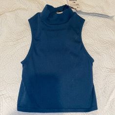 Nwts Zara Sleeveless Turtleneck. Part Of The Limitless Contour Collection - More Of A Teal Color - Size Xs/S Casual Stretch Halter Neck Vest, Blue Stretch High Neck Tank Top, Blue High Neck Stretch Tank Top, Blue Fitted High Neck Tank Top, Fitted Sleeveless Halter Top Casual Style, Fitted High Neck Blue Tank Top, Trendy Blue Vest Top, Casual Stretch Halter Top Sleeveless Blouse, Casual Stretch Halter Top