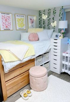 a bedroom with a bed, dresser and other items on the floor in front of it