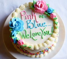 a white cake with blue and pink frosting on it that says, find the blue we love you