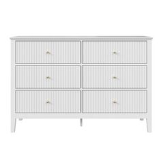 a white dresser with four drawers