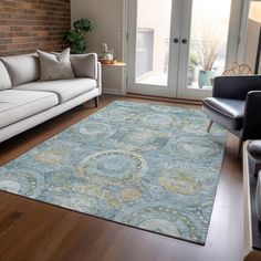 a living room filled with furniture and a large rug