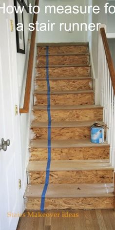 the stairs are being painted with blue tape