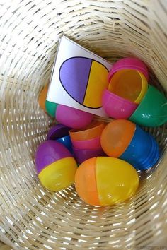 a basket filled with lots of colorful plastic toys