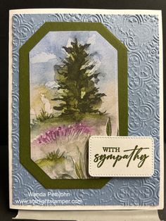 a close up of a card with a tree on it