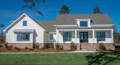 a white house with black shutters and windows