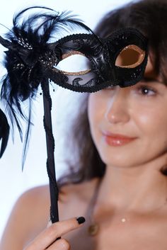 Adorned with intricate Rose gold shimmer around the eyes, this mask exudes sophistication and mystique. The handheld stick ensures comfort and convenience. Hold your mask with grace and poise while you dance, converse, and enjoy the festivities without any hassle. Elevate your presence at masquerade balls, proms, galas, or any event with this handheld mask. Age Group/Gender - Adult/Women Size/Type - One size fits all adults Mask Color - Black Mask Material - Polyresin Special Features - Shimmer Mardi Gras Kid, Kids Party Packs, Masquerade Mask Women, Black Masquerade, Feather Mask, Female Mask, Masks Masquerade, Glitter Eyes, Masquerade Mask