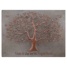 a metal plaque with a tree on it that says, love is the best ingredient