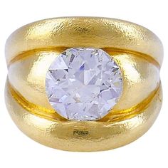 An impressive chunky 18k gold band ring featuring an Old European cut diamond. A striking combo of the big (4.86 carats) diamond mounted flush in the gold creates a great look. The gold is slightly textured which adds to the massiveness of the ring. Rounded sculptural edges perfectly frame the diamond. Whether it's a big party or an important meeting, this diamond ring will make a powerful statement wherever you go. This cocktail ring is made of 18 karat yellow gold (stamped) and set with a 4.86 Dimond Ring, The Big 4, Antique Jewelry Rings, Sculptural Jewelry, Art Deco Movement, Big Party, Gold Band Ring, European Cut Diamonds, Diamond Gold