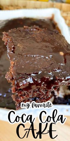 a close up of a piece of cake on a plate with the words my favorite coca cola cake