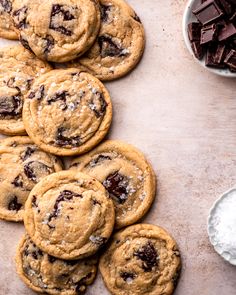 chocolate chip cookies are arranged on a baking sheet