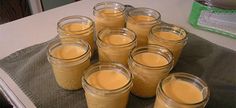 several jars filled with liquid sitting on top of a table