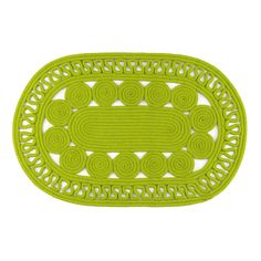 a green rug with an oval design on it