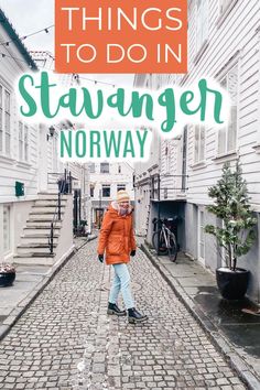 a person walking down a cobblestone street with the words things to do in stavanger norway