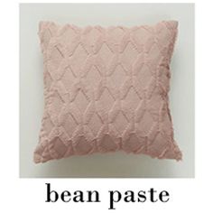 a pink pillow with the words bean pastee on it and an image of a white background