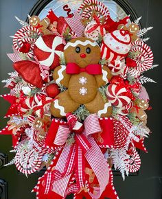 a christmas wreath with gingerbreads and candy canes