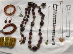 19 piece collection of  high-quality boho jewelry from the 70s to early 2000s. All in excellent to new condition. Many pieces * were purchased for over $100 each. The lot includes :  70s amber stretch bracelet Early 2000s Alex & Ani silver bracelet with fleur de lis & recycle or karma (what goes around comes around) charms 70s amber drop earrings on 14K wires 80s amber bracelet with stamped silver T-bar closure 70s stretch shell bracelet, gorgeous yellow gold with iridescence * Early 2000s Long Early 2000s Jewelry, Jewelry 70s, 2000s Jewelry, 2000s Boho, Lavender Stone, 70s Jewelry, Shoulder Duster Earrings, Lotus Ring, What Goes Around Comes Around