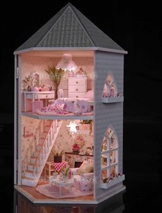 a doll house with furniture and accessories inside