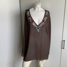 Lane Bryant 26/28 Brown V-Neck Long Sleeve Tunic Blouse. Sequins Around Hem And Embroidery Around Neck. Item Is In Nwt Condition. All Of Our Items Come From A Smoke Free Home. Measurements: Shoulder To Shoulder 21” Pit To Pit 30” Shoulder To Cuff 26” Shoulder To Hem 28.5” Materials: 100% Polyester ***Visit Our Store, Joebooh2 Resale, Where We Always Combine Shipping On Multiple Purchases*** Buy With Confidence As We Have Been Selling Online Since 1999. All Questions Answered Within Eight Hours. Casual V-neck Blouse With Embroidered Neckline, V-neck Embroidered Blouse For Vacation, Floral Embroidered V-neck Blouse For Vacation, V-neck Beach Blouse, V-neck Blouse For Beach, Embroidered V-neck Blouse For Vacation, V-neck Tops With Floral Embroidery For Vacation, Beach V-neck Top With Embroidered Neckline, V-neck Top With Embroidered Neckline For Vacation