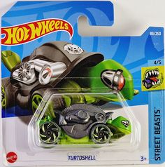 a green toy car with wheels on it