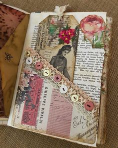 an altered book with buttons and flowers on the pages is sitting on a carpeted surface