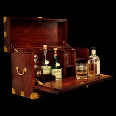 an open wooden box with liquor bottles in it