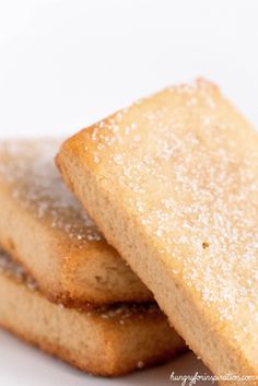 three sugary shortbreads stacked on top of each other