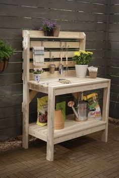 a potting bench made out of pallet wood with plants on the top shelf