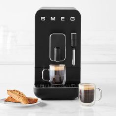 an espresso machine sitting next to two slices of bread