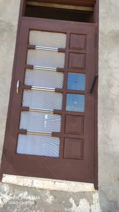 a brown door with glass panels on it