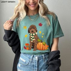 The cutest fall Goldendoodles with a pumpkin - ready to enjoy fall weather! Premium, luxurious Comfort Colors® 1717 t-shirt you will not want to take off is the perfect doodle lover gift and will bring cheerful autumn vibes to you and your family. ✅ Exceptionally Comfy 100% Ring-Spun Cotton T-Shirt That Feels "Broken in" And Soft For Your Skin ✅ Garment Is Made With The Most Expensive Dyeing Process, Reducing Shrinking Up To 99% ✅ Relaxed, Unisex Fit Will Be Great For Women And Men (To Get That White T-shirt With Cat Design For Fall, Playful Fall T-shirt With Cartoon Print, Golden Doodle, Fall Cat Design Short Sleeve T-shirt, Cotton T-shirt With Dog Print For Fall, Christmas Doodles, Halloween Cat Print Crew Neck T-shirt, Dog Mom Shirt, Fall Weather