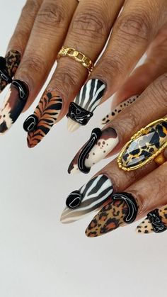 🎨 SU NGUYEN 🎨 on Instagram: "Serving up some wild and sexy vibes 🔥🔥 with these fierce animal prints ! 🐅🐆🦓 Animal prints nail design with black 3D accents 🖤 Which’s one your favorite?  ★𝐒𝐚𝐮𝐯𝐚𝐠𝐞_𝐀𝐫𝐭𝐢𝐬𝐭𝐫𝐲★ 𝙽𝚊𝚒𝚕 𝙰𝚛𝚝 𝚋𝚢 𝚂𝚞  . . . . . . . . . . . . . #fallnails #nailart  #nailartist #artist #aesthetic #naildesign #nails #fall #nailsinspiration #aestheticnails #nailalabama #birminghamnails #alabamanails #alabamanailartist  #nailtrend #trending #nailinspo  #nails #naildesigns #nailfeed #handpaintednails #freestylenails #sexynails  #nailsdesign #animalnails #atalantanails #brownnails  #almondnails #nailsart" Safari Nail Ideas, Nail Artist Branding, Trendy Nail Designs 2024, Intricate Nail Art, Animal Nail Art Designs, Tiger Print Nails, Fall Cheetah Nails, Nail Art Tiger Print