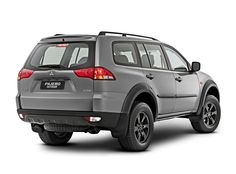 the rear end of a silver suv on a white background