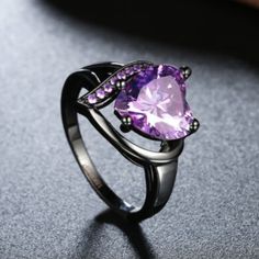 Blach Rhodium Plating Over Sterling Silver. Purple Heart Shaped Center Stone With Purple Accenting Stone Detail. Red Diamond Ring, Black Gold Ring, Measure Ring Size, Ring Man, Purple Sapphire, Red Diamond, Purple Rhinestone, Rhinestone Ring, Band Jewelry