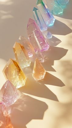 A serene and aesthetic image of energy lines passing through chakras, featuring small hexagonal prism crystals (5-10 cm) against a light beige background. No text, photorealistic style. Mantra