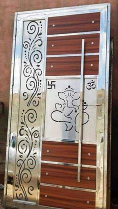 an open door with decorative designs on the front and side panels in silver, brown and white