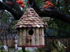 a bird house made out of wine corks