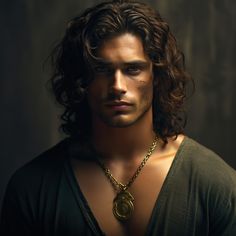 a man with long curly hair wearing a necklace and looking at the camera while standing in front of a dark background