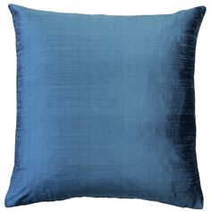 a blue pillow on a white background